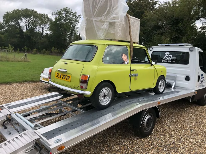 Classic Mini car being recovered in London